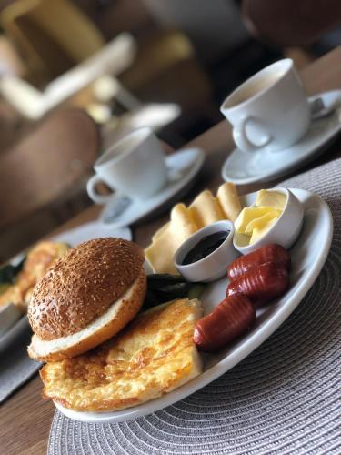 a plate of breakfast food on a table at Blueberryhouse in Bukovel