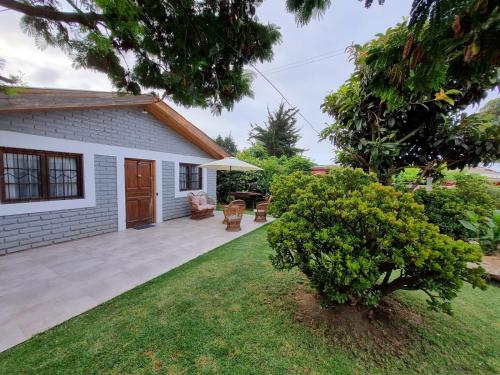 a backyard of a house with a patio at Casa Jade in Quintero