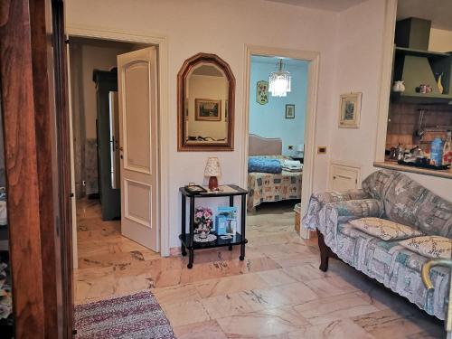 a living room with a couch and a table at La Casina di sopra AAUT in Sestri Levante
