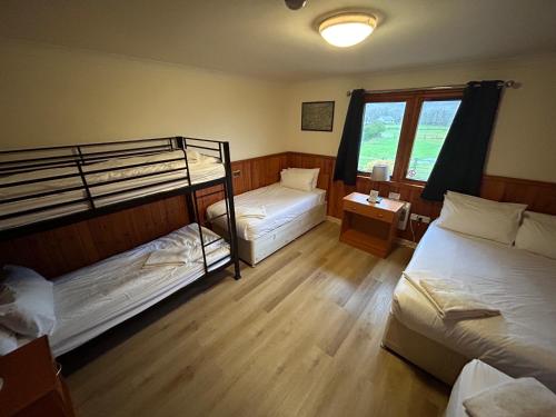 Postel nebo postele na pokoji v ubytování Roam West