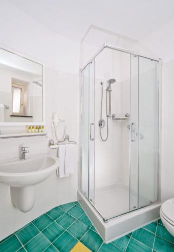 a bathroom with a shower and a sink at Hotel Le Axidie in Vico Equense