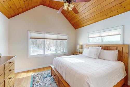 a bedroom with a bed and a ceiling fan at 61 East Field Road in Jackson