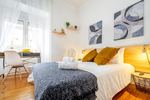 Ένα ή περισσότερα κρεβάτια σε δωμάτιο στο April Square Guesthouse by Lisbon with Sintra - shared bathrooms