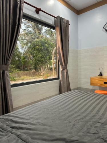 Ένα ή περισσότερα κρεβάτια σε δωμάτιο στο Homestay 1991