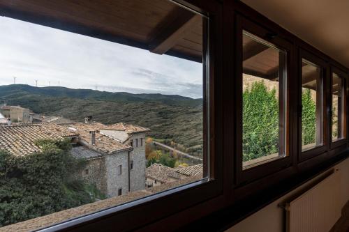 a window with a view of a city at Parador de Sos del Rey Católico in Sos del Rey Católico