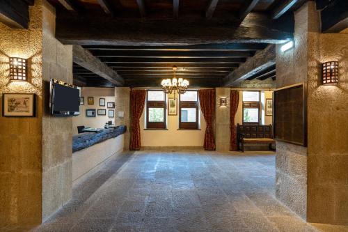a large room with a chandelier in a building at Parador de Sos del Rey Católico in Sos del Rey Católico