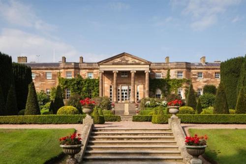 a large house with stairs in front of it at Royal Hillsborough Village Luxury Townhouse in Hillsborough
