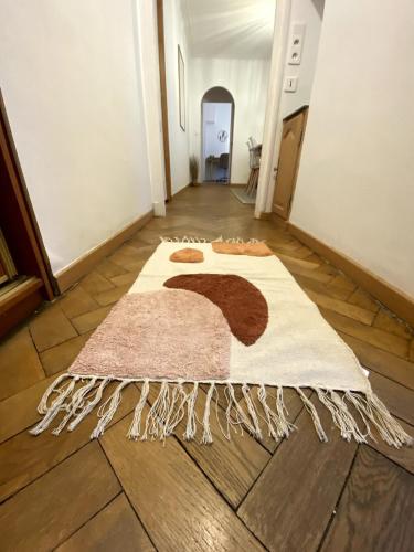 a hallway with a rug on the floor at My Pommery#reims in Reims