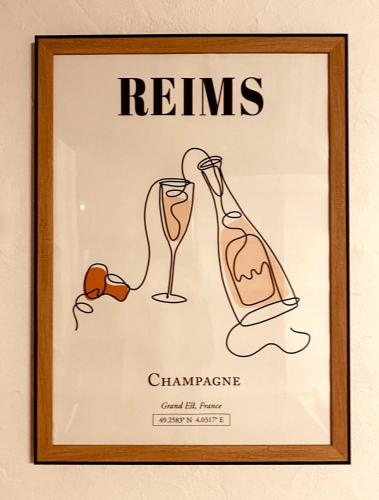 a framed picture of a champagne bottle and glasses at My Pommery#reims in Reims