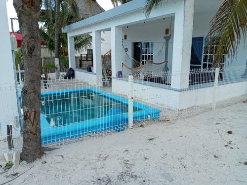 a house with a swimming pool in front of a house at casa de los abuelos in San Crisanto