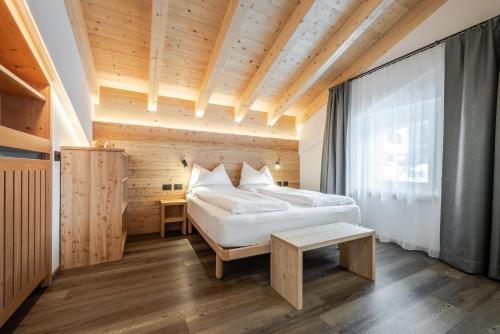 A bed or beds in a room at HOTEL B&B MARILENA