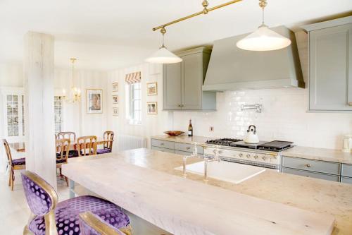 a kitchen with a large counter top in a room at Lough Erne Resort Villa in Ballycassidy