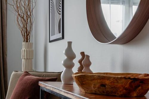 a living room with a table with a bowl on it at Simple studio in trendy Södermalm - construction work in Stockholm