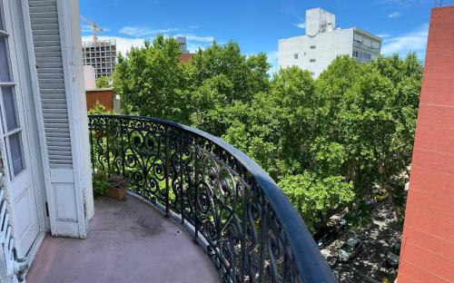 a balcony with a metal railing on a building at Edificio Quijano in Montevideo