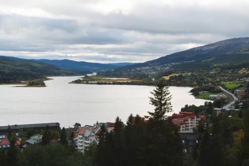 a view of a large body of water with buildings at Chic Are Apt for 6 Ski-in-Ski-out with Sauna in Åre