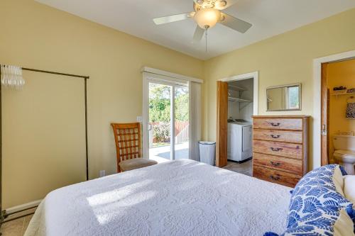 a bedroom with a bed and a ceiling fan at Peaceful Naalehu Paradise 5 Mi to Beach! in Naalehu
