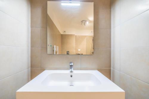 a bathroom with a sink and a mirror at Residence A Marina in Lumio