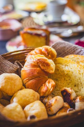 a plate of bread and pastries on a table at Quinta da Bocaina in Amparo
