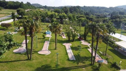 an aerial view of a park with palm trees at campeggio internazionale del sole in Viverone