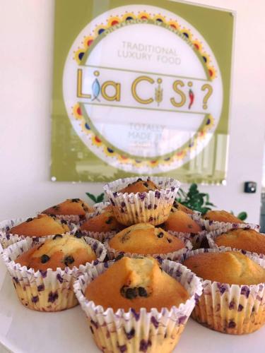 a pile of blueberry muffins sitting on a table at Cinquecento B&B in Barcellona-Pozzo di Gotto