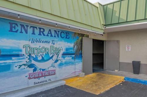 an entrance to a building with an entrance to a tarleton aquarium at Heated Pool, Strong WI-FI, TV, Tiki Bar & Grill! in Sarasota