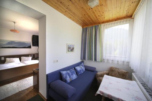 Ένα ή περισσότερα κρεβάτια σε δωμάτιο στο Gästehaus Lienharterhof