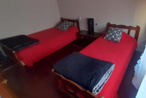 En eller flere senger på et rom på Casa Huésped Shalom
