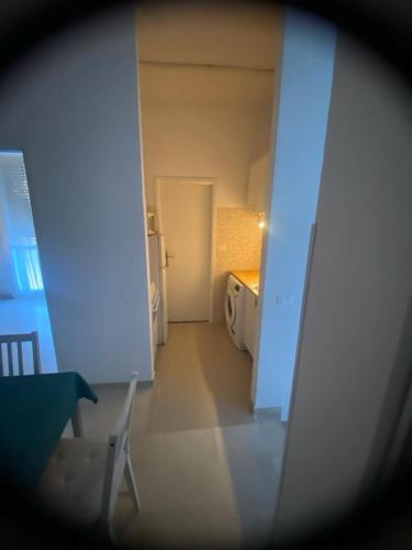 a view of a room with a bed and a hallway at Casa di Anna in Ravenna