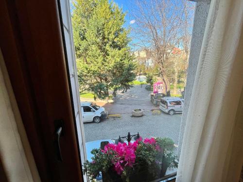 an open window with a view of a parking lot at Meydan Suites in Istanbul
