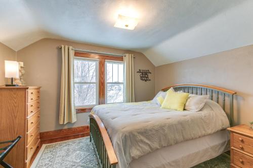 A bed or beds in a room at Quaint Howells Retreat - Steps from Main Street!
