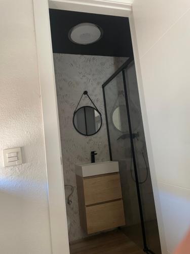 a bathroom with a sink and a mirror at Río Genil in Pinos Genil