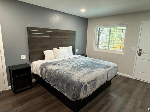 a bedroom with a large bed and a window at Deep Creek in Arrowbear Lake