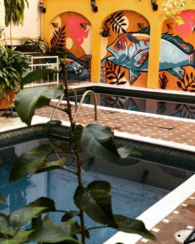 a painting of a fish on the side of a building at Pargos Hotel & Cowork in Puerto Escondido