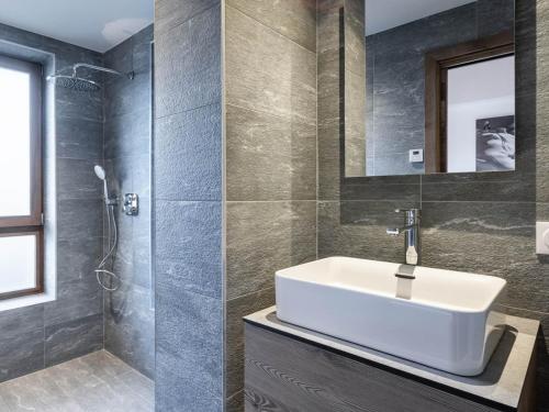 a bathroom with a white sink and a shower at Appartement Courchevel 1650, 3 pièces, 6 personnes - FR-1-618-30 in Courchevel