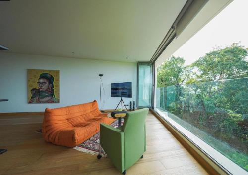 TV a/nebo společenská místnost v ubytování Bluepoint SeaView Retreat Patong