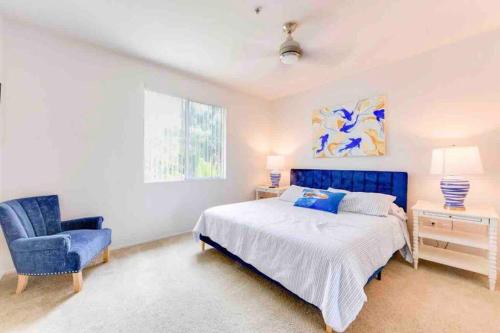 a bedroom with a blue bed and a blue chair at HubLife Your Private Oasis in the Heart of Marina del Rey in Los Angeles