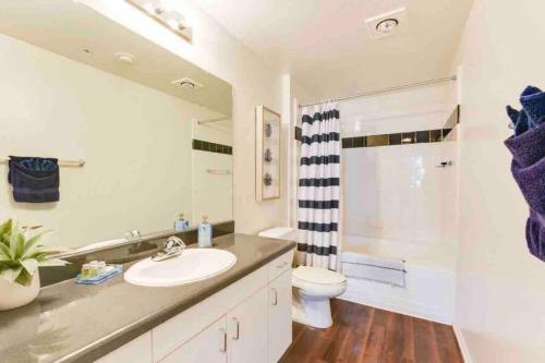 a bathroom with a sink and a toilet and a shower at HubLife Your Private Oasis in the Heart of Marina del Rey in Los Angeles