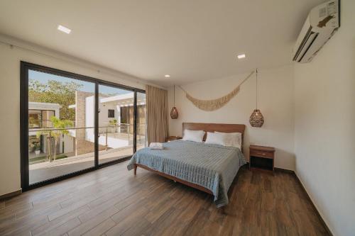 Postel nebo postele na pokoji v ubytování Beach House “El Rosario”
