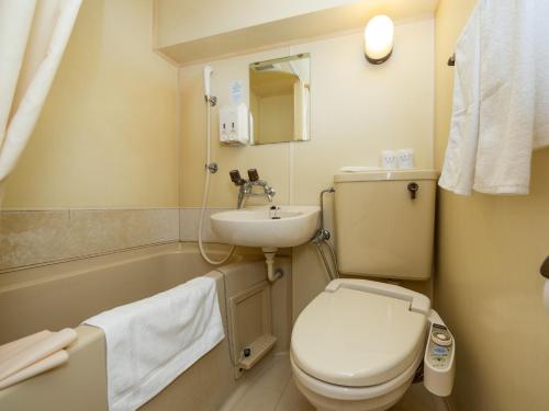 a bathroom with a toilet and a sink at Sky Heart Hotel Koiwa - Vacation STAY 51656v in Tokyo