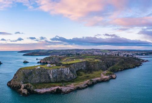 an island in the ocean with a town on it at Parkside Lodge - Luxury Coastal Hideaway for Two in Brixham