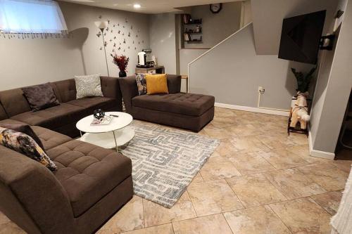 a living room with a couch and a table at Beautiful & Cozy one Bedroom Apartment near Boston & Airport in Saugus