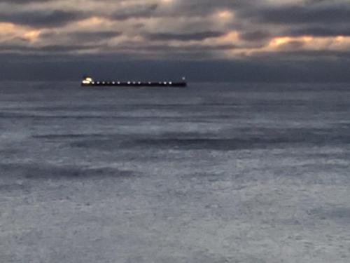 a pier in the ocean with a lit up at Incredible Views w Garage on Lake and bike trail in Tofte
