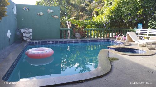 a small swimming pool with a toy in the water at Casa Clorophila in Vila Velha