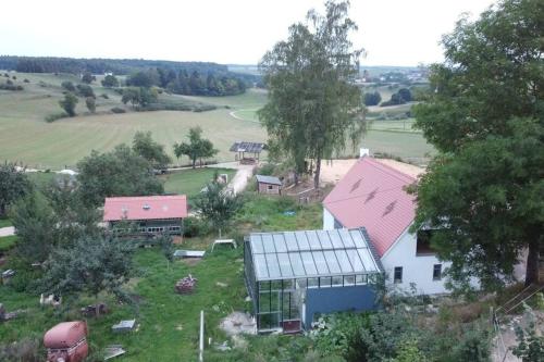 an aerial view of a farm with a house and a barn at Erlebnishof Bauernhof Ferienhaus 