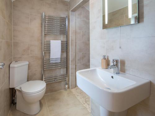 a bathroom with a white toilet and a sink at 4 bed property in Instow Devon 59699 in Instow