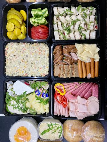 a lunch box filled with different types of food at Stodoła Na Kresach - widokowy domek drewniany, całoroczny JACUZZI & SAUNA in Bodzentyn