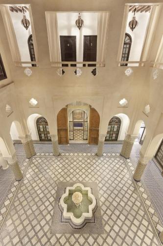 a large room with a tile floor and a ceiling at Riad Palais Bahia Fes in Fès