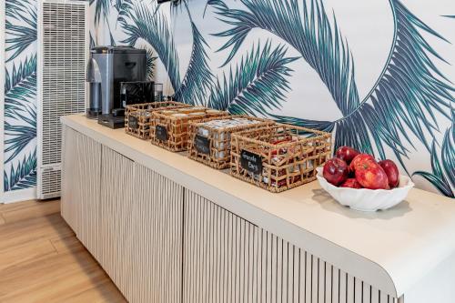 a counter with a bowl of fruit on it at Santa Monica Hotel in Los Angeles