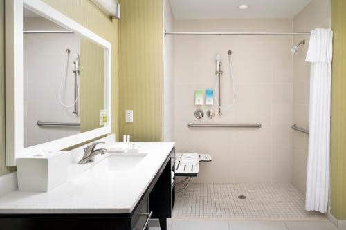 a bathroom with a sink and a shower at Home2 Suites by Hilton Lake City in Lake City