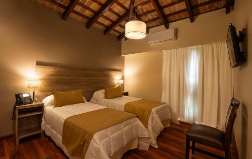 Μια τηλεόραση ή/και κέντρο ψυχαγωγίας στο Hotel Intersur La Cumbre
